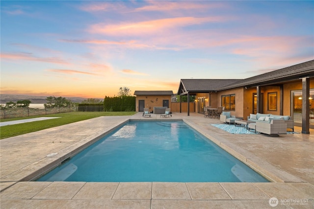 510 Lakeside Way SW, Mattawa, WA 99349 - pool at dusk featuring an outdoor hangout area, a patio, and an outdoor structure