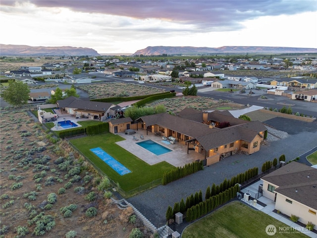 510 Lakeside Way SW, Mattawa, WA 99349 - aerial view of residential area with a mountainous background and a pool area