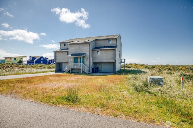 1472 Storm King Ave SW Unit A, Ocean Shores, WA 98569 - view of front of property with a garage