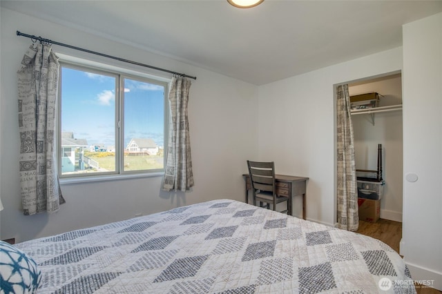 1472 Storm King Ave SW Unit A, Ocean Shores, WA 98569 - bedroom with wood finished floors, a closet, and baseboards