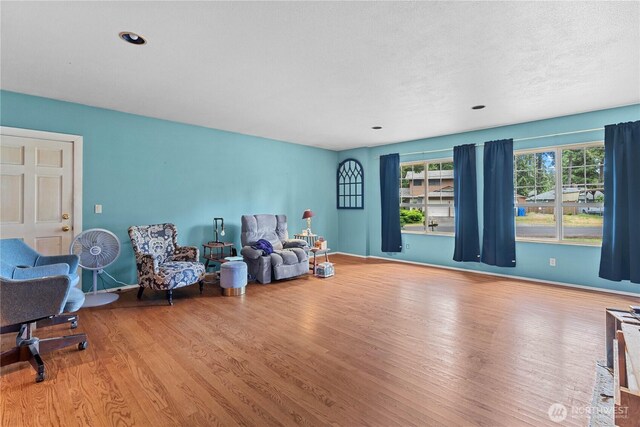 9712 126th St E, Puyallup, WA 98373 - sitting room featuring wood finished floors and baseboards