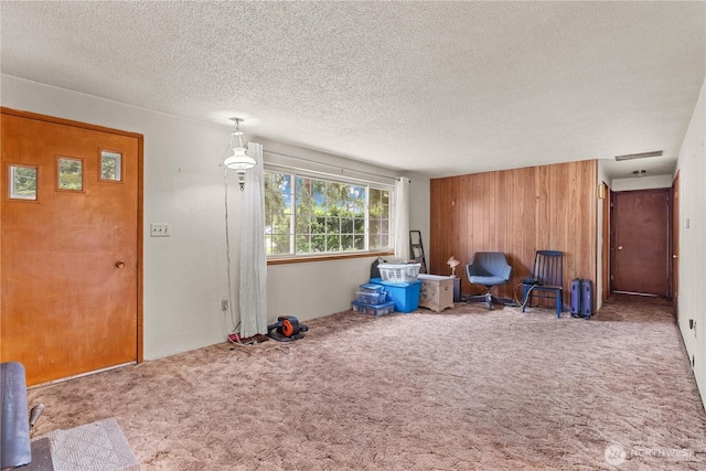 9712 126th St E, Puyallup, WA 98373 - unfurnished room featuring carpet, wood walls, and a textured ceiling