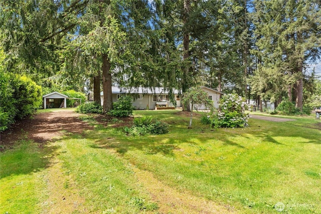 9712 126th St E, Puyallup, WA 98373 - view of green lawn featuring a detached carport and an outdoor structure