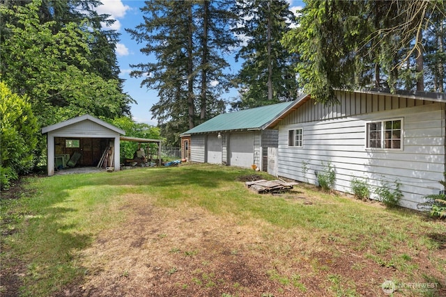 9712 126th St E, Puyallup, WA 98373 - view of green lawn with a garage