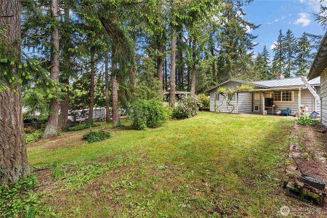 9712 126th St E, Puyallup, WA 98373 - view of grassy yard featuring a patio area