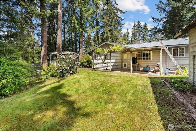 9712 126th St E, Puyallup, WA 98373 - view of grassy yard with a patio area