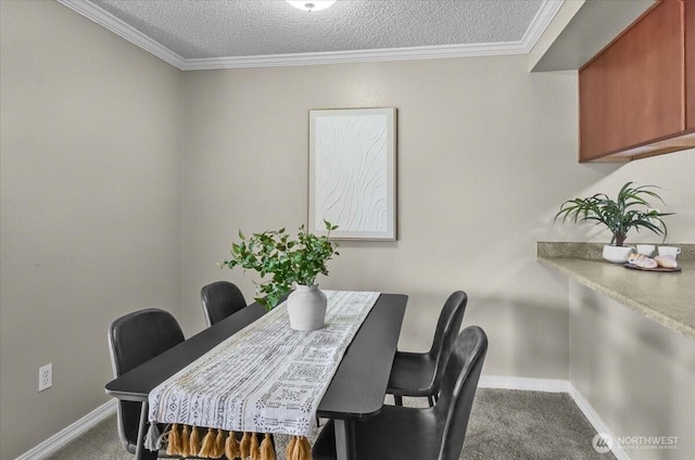 13013 E Gibson Rd Unit M223, Everett, WA 98204 - dining room with carpet floors, baseboards, a textured ceiling, and ornamental molding