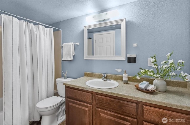13013 E Gibson Rd Unit M223, Everett, WA 98204 - bathroom with toilet, vanity, a textured ceiling, and a textured wall