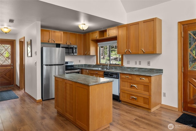 760 Rodeo Rd, Cle Elum, WA 98922 - kitchen with appliances with stainless steel finishes, dark countertops, wood finished floors, and a sink