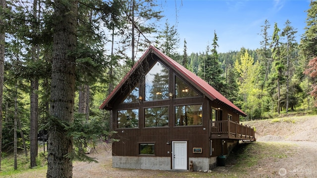 760 Rodeo Rd, Cle Elum, WA 98922 - back of property featuring a forest view and a wooden deck