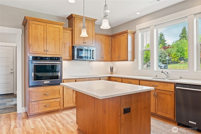 15 Cabana Dr, Silverlake, WA 98645 - kitchen featuring stainless steel appliances, a sink, light countertops, tasteful backsplash, and recessed lighting