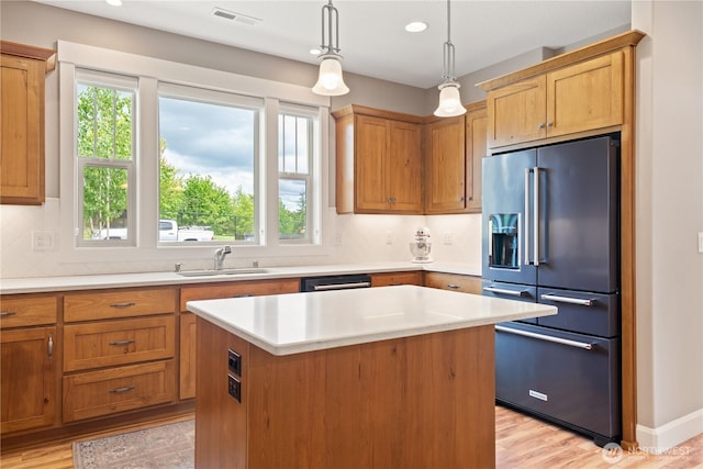 15 Cabana Dr, Silverlake, WA 98645 - kitchen with high end refrigerator, a sink, light countertops, a center island, and backsplash