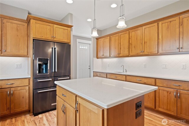 15 Cabana Dr, Silverlake, WA 98645 - kitchen with high end refrigerator, a sink, light wood finished floors, backsplash, and recessed lighting