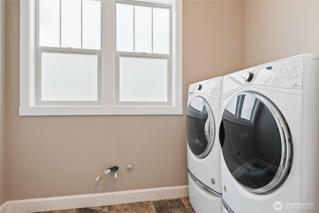 15 Cabana Dr, Silverlake, WA 98645 - laundry room featuring baseboards, washing machine and clothes dryer, and stone finish floors