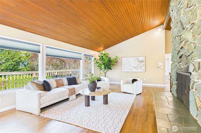 1323 121st Ave SE, Bellevue, WA 98005 - living area featuring wood ceiling, baseboards, wood finished floors, a fireplace, and high vaulted ceiling