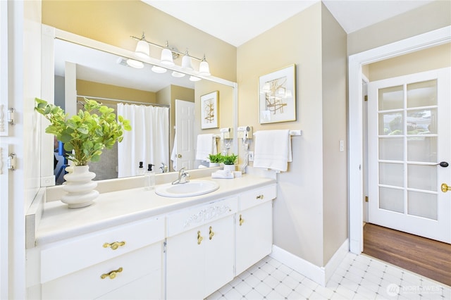 1323 121st Ave SE, Bellevue, WA 98005 - full bathroom featuring baseboards and vanity
