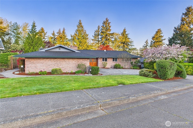 1323 121st Ave SE, Bellevue, WA 98005 - single story home featuring brick siding, a front lawn, and a chimney