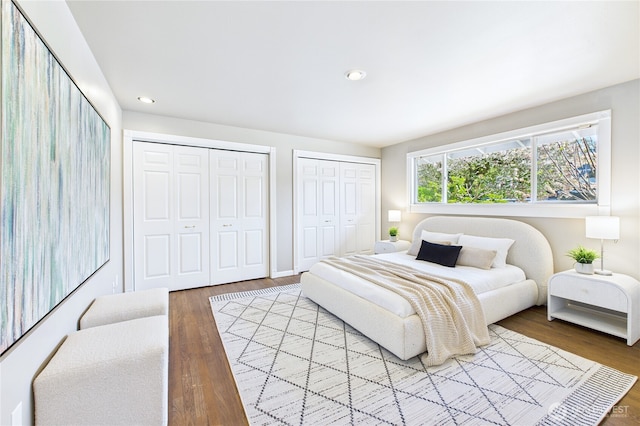 1323 121st Ave SE, Bellevue, WA 98005 - bedroom featuring multiple closets, wood finished floors, and recessed lighting