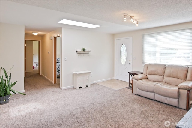 2018 S 253rd St, Des Moines, WA 98198 - living room with carpet floors, a skylight, and a textured ceiling