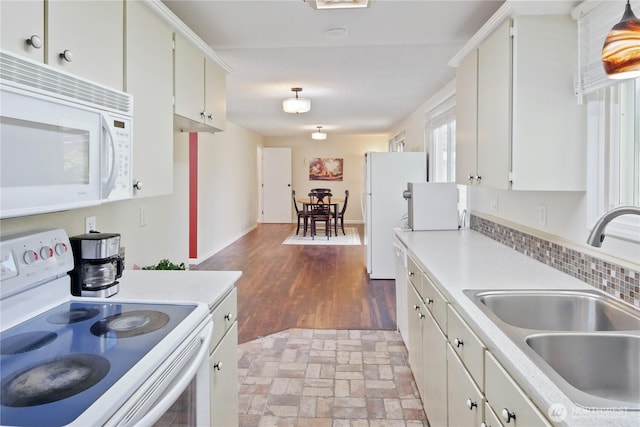 2018 S 253rd St, Des Moines, WA 98198 - kitchen featuring white appliances, a sink, light countertops, and white cabinetry