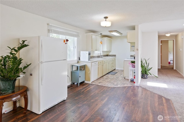 2018 S 253rd St, Des Moines, WA 98198 - kitchen featuring white appliances, a sink, wood finished floors, light countertops, and a textured ceiling