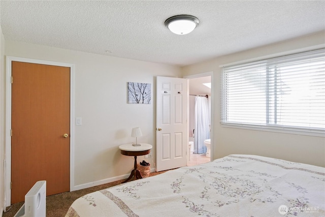 2018 S 253rd St, Des Moines, WA 98198 - bedroom with a textured ceiling, baseboards, and ensuite bathroom
