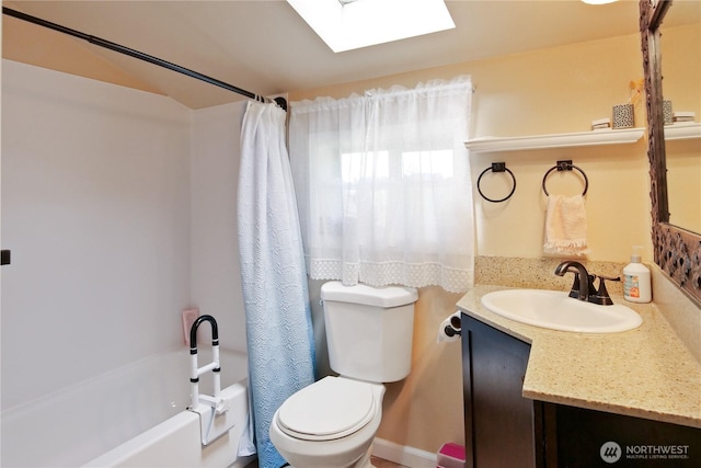 2018 S 253rd St, Des Moines, WA 98198 - bathroom featuring toilet, a skylight, vanity, and shower / tub combo