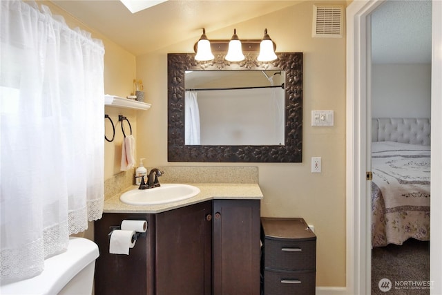 2018 S 253rd St, Des Moines, WA 98198 - bathroom featuring lofted ceiling and vanity