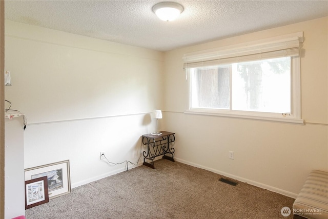 2018 S 253rd St, Des Moines, WA 98198 - unfurnished room with a textured ceiling, carpet floors, and baseboards