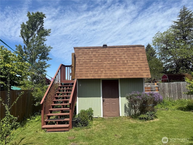 2018 S 253rd St, Des Moines, WA 98198 - back of property with roof with shingles, stairway, an outbuilding, and a deck
