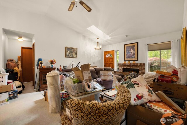 26603 199th Pl SE, Covington, WA 98042 - carpeted living room featuring lofted ceiling, a ceiling fan, a chandelier, a brick fireplace, and a skylight