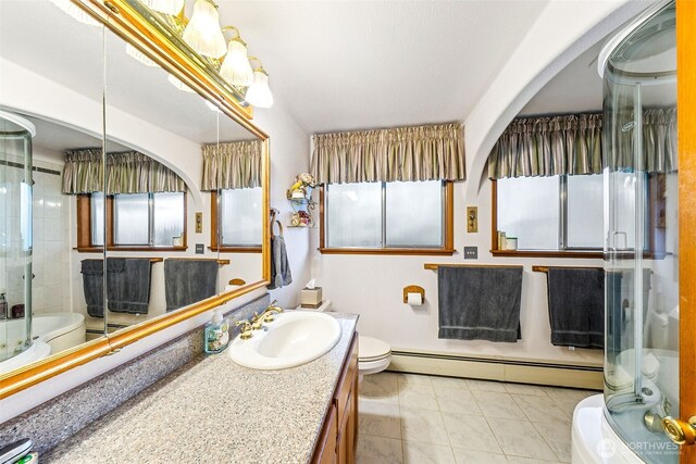 38205 183rd Ave SE, Auburn, WA 98092 - full bath featuring a baseboard heating unit, toilet, and vanity