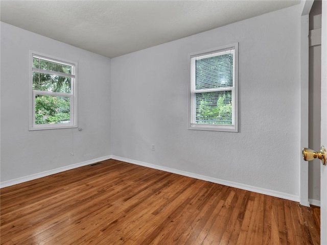 14746 26th Ave NE, Shoreline, WA 98155 - unfurnished room featuring wood-type flooring and baseboards