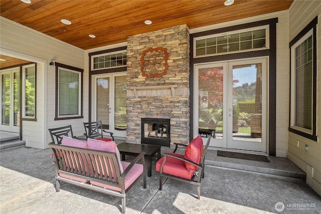 15002 147th Ave E, Orting, WA 98360 - porch featuring french doors and an outdoor stone fireplace