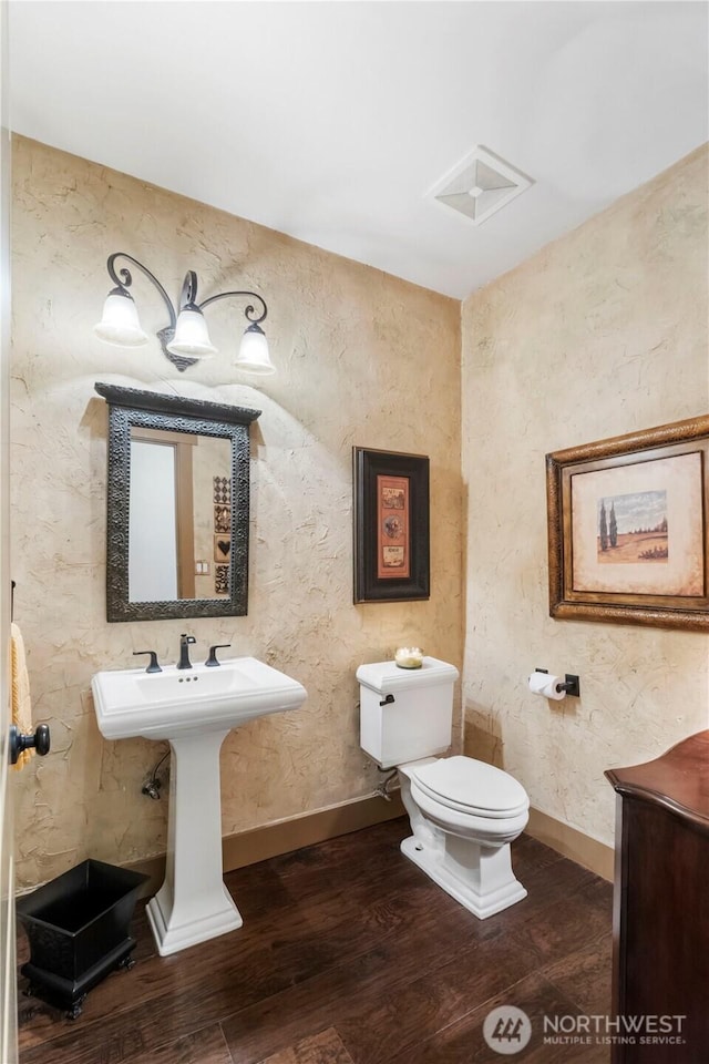 29122 71st Ave E, Graham, WA 98338 - bathroom featuring wood finished floors, toilet, and baseboards
