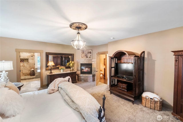 29122 71st Ave E, Graham, WA 98338 - bedroom with a tile fireplace, light colored carpet, and connected bathroom