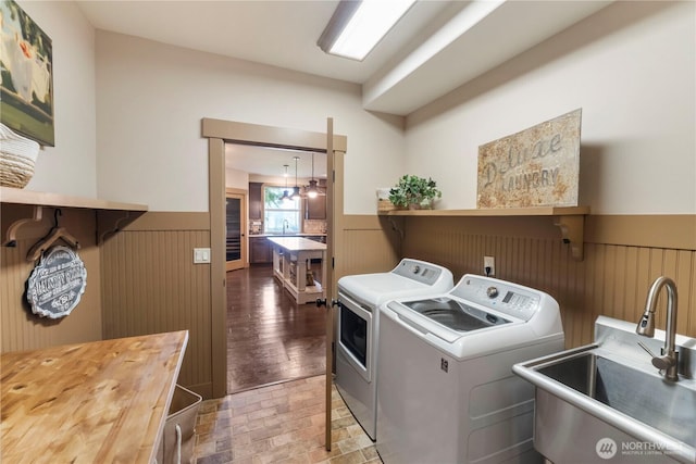 29122 71st Ave E, Graham, WA 98338 - laundry area featuring washer and clothes dryer, wainscoting, and wood walls