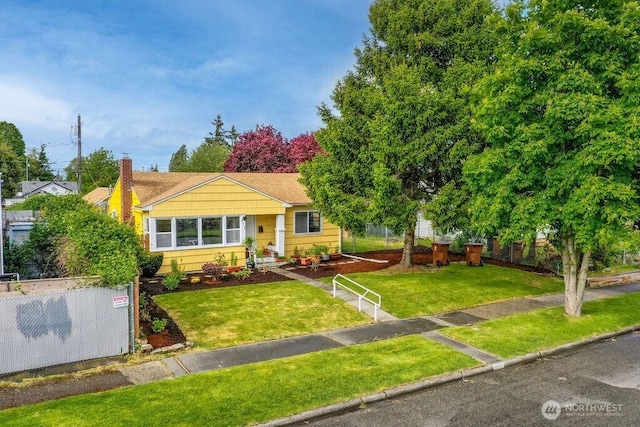 811 E 60th St, Tacoma, WA 98404 - view of front of house with a chimney and a front yard