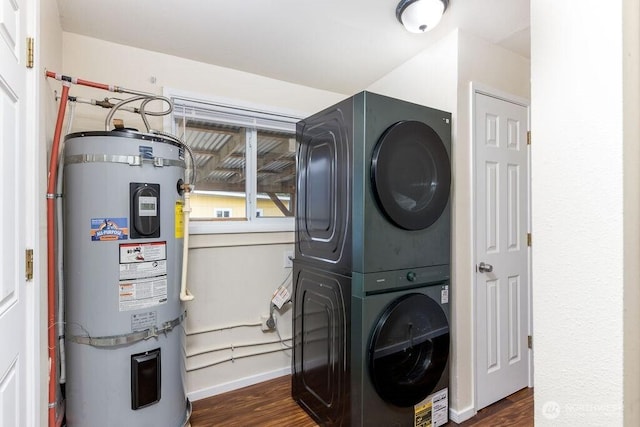 811 E 60th St, Tacoma, WA 98404 - laundry area featuring strapped water heater, estacked washer and dryer, dark wood-style flooring, and baseboards