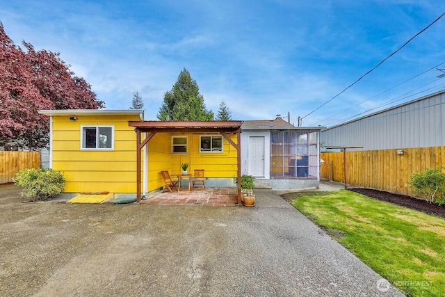 811 E 60th St, Tacoma, WA 98404 - back of house featuring a patio area