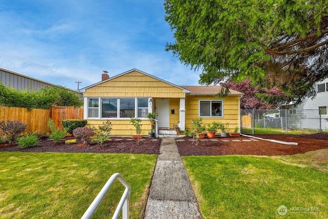 811 E 60th St, Tacoma, WA 98404 - bungalow-style home with a chimney