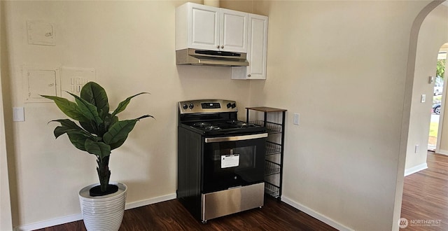 811 E 60th St, Tacoma, WA 98404 - kitchen with electric stove, under cabinet range hood, arched walkways, white cabinets, and dark wood-type flooring