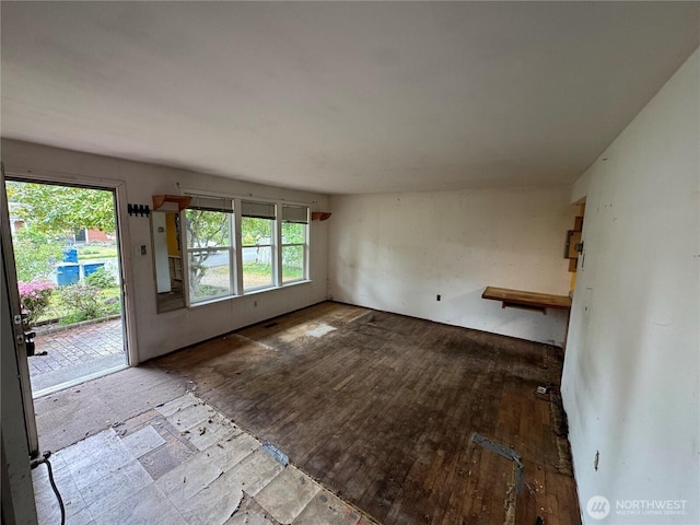 7815 203rd St SW, Edmonds, WA 98026 - unfurnished living room with healthy amount of natural light and wood finished floors