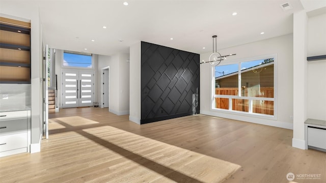 17109 NE 16th Pl, Bellevue, WA 98008 - entrance foyer featuring light wood-type flooring, baseboards, a chandelier, and recessed lighting