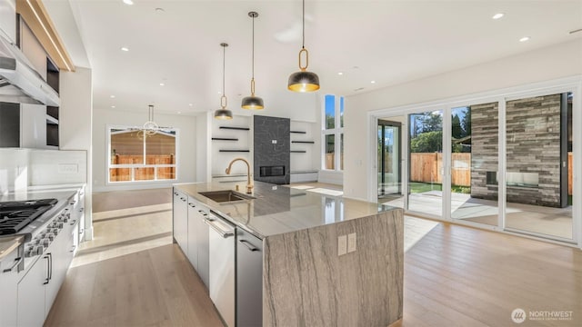 17109 NE 16th Pl, Bellevue, WA 98008 - kitchen featuring a sink, modern cabinets, a fireplace, light wood finished floors, and recessed lighting