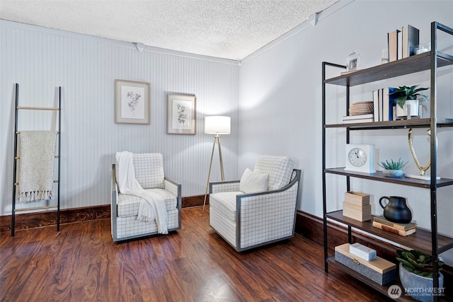 17009 15th Ave E, Spanaway, WA 98387 - living area with a textured ceiling, wood finished floors, baseboards, and crown molding