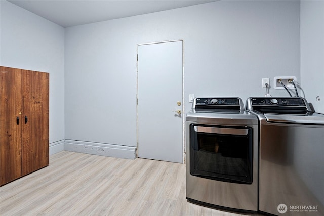17009 15th Ave E, Spanaway, WA 98387 - laundry room featuring independent washer and dryer and light wood-style flooring