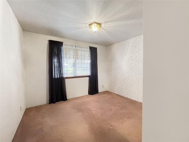 2147 Beverly Blvd, Shelton, WA 98584 - carpeted empty room with a textured ceiling and wallpapered walls