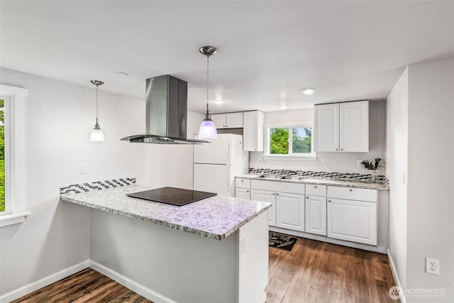 2042 E Harrison St, Tacoma, WA 98404 - kitchen featuring island range hood, freestanding refrigerator, black electric stovetop, dark wood-style floors, and a peninsula