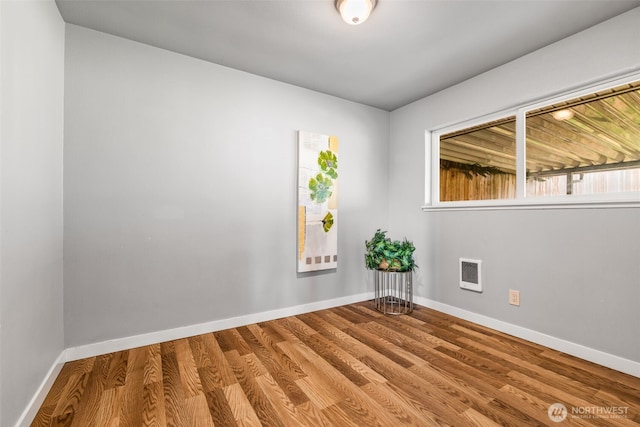 2042 E Harrison St, Tacoma, WA 98404 - empty room featuring baseboards and wood finished floors